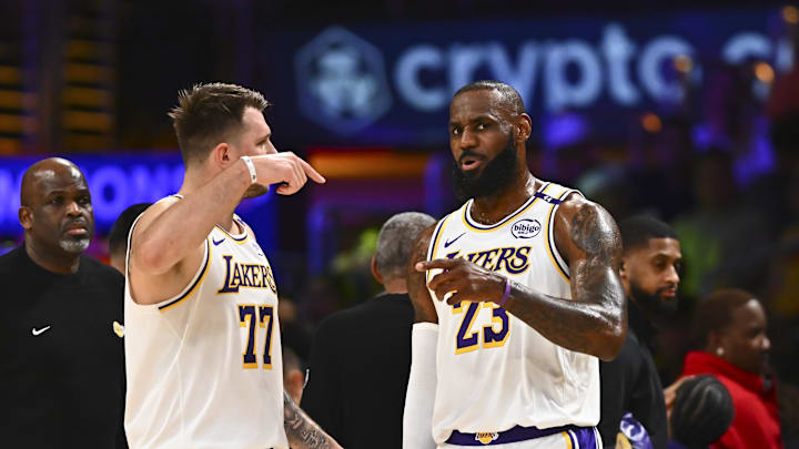 Mar 22, 2025; Los Angeles, California, USA; Los Angeles Lakers guard Luka Doncic (77) and Los Angeles Lakers forward LeBron James (23) on the sidelines against the Chicago Bulls during the first half at Crypto.com Arena. Mandatory Credit: Jonathan Hui-Imagn Images Mar 22, 2025; Los Angeles, California, USA; Los Angeles Lakers guard Luka Doncic (77) and Los Angeles Lakers forward LeBron James (23) on the sidelines against the Chicago Bulls during the first half at Crypto.com Arena. Mandatory Credit: Jonathan Hui-Imagn Images