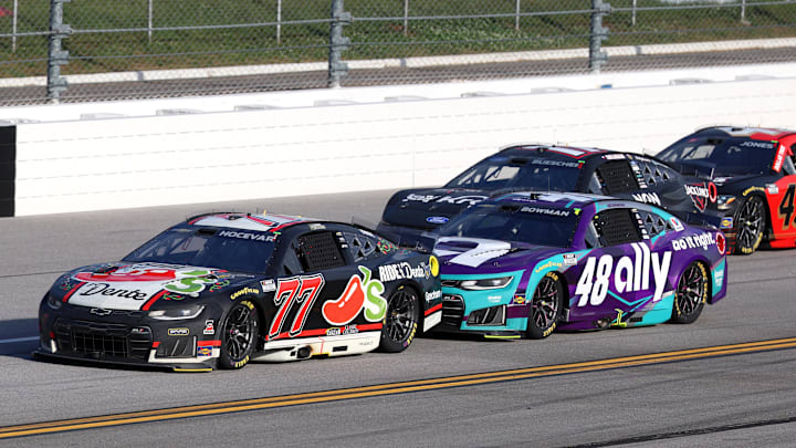 Apr 26, 2026; Talladega, Alabama, USA; NASCAR Cup Series driver Carson Hocevar (77) leads against NASCAR Cup Series driver Alex Bowman (48) during stage three of the Jack Links 500 NASCAR Cup Series race at Talladega Superspeedway.