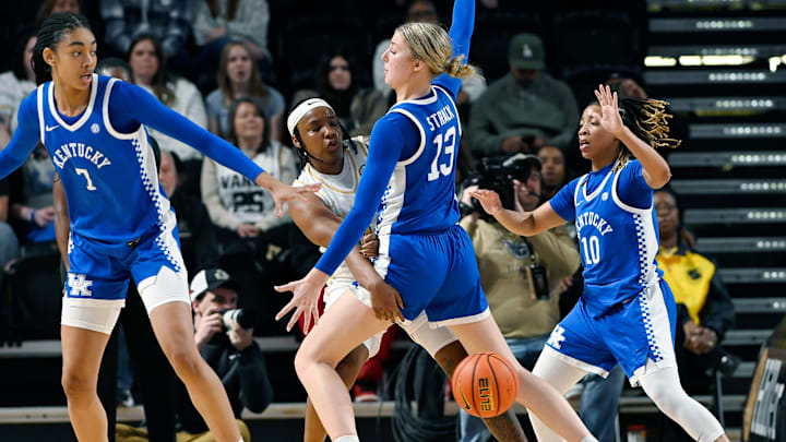 Vanderbilt guard Jordyn Oliver (11) passes the ball as Kentucky center Clara Strack (13) defends during an NCAA college basketball game Sunday, Jan. 5, 2025, in Nashville, Tenn.