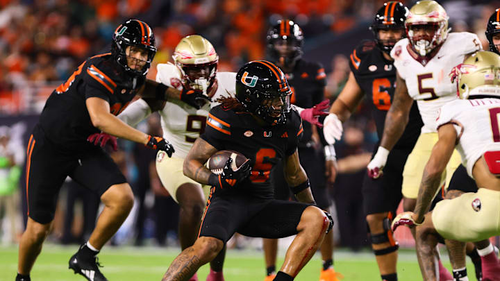 Oct 26, 2024; Miami Gardens, Florida, USA; Miami Hurricanes running back Damien Martinez (6) runs with the football against the Florida State Seminoles during the second quarter at Hard Rock Stadium. Mandatory Credit: Sam Navarro-Imagn Images