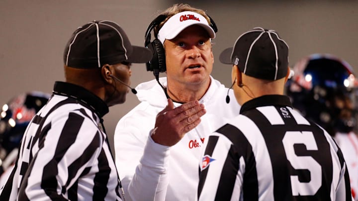 Nov 23, 2023; Starkville, Mississippi, USA; Mississippi Rebels head coach Lane Kiffin talks with the referees during the second half against the Mississippi State Bulldogs at Davis Wade Stadium at Scott Field. Mandatory Credit: Petre Thomas-USA TODAY Sports