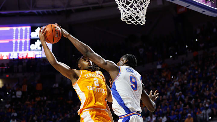 Jan 7, 2025; Gainesville, Florida, USA; Florida Gators center Rueben Chinyelu (9) blocks a layup from Tennessee Volunteers guard Chaz Lanier (2) during the first half at Exactech Arena at the Stephen C. O'Connell Center. Mandatory Credit: Matt Pendleton-Imagn Images
