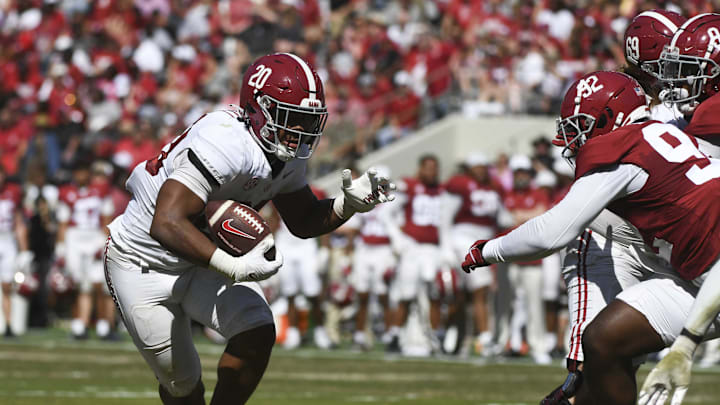 Apr 13, 2024; Tuscaloosa, AL, USA;  Alabama running back Daniel Hill (20) looks for room to run as he is pursued by Alabama defensive lineman Jeremiah Beaman (92) during the A-Day scrimmage at Bryant-Denny Stadium. Mandatory Credit: Gary Cosby Jr.-Imagn Images