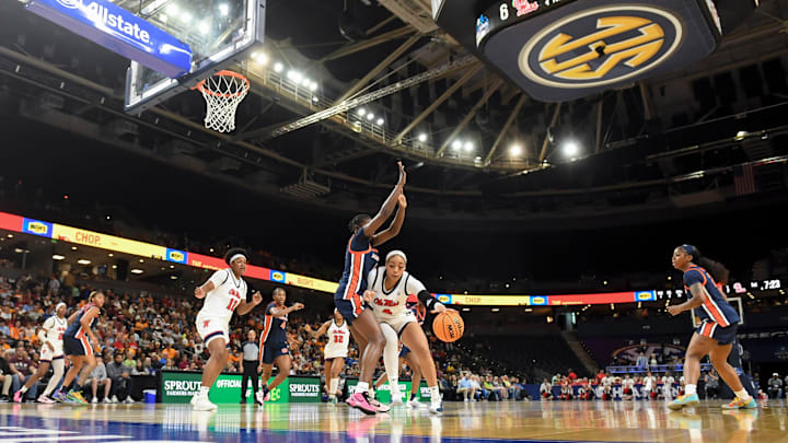 Ole Miss Rebels forward Jayla Murray (4) is defended by Auburn Tigers forward Khady Leye (6) Thursday, March 5, 2026, during the SEC Women's Basketball Tournament second round game at Bon Secours Wellness Arena in Greenville, South Carolina.