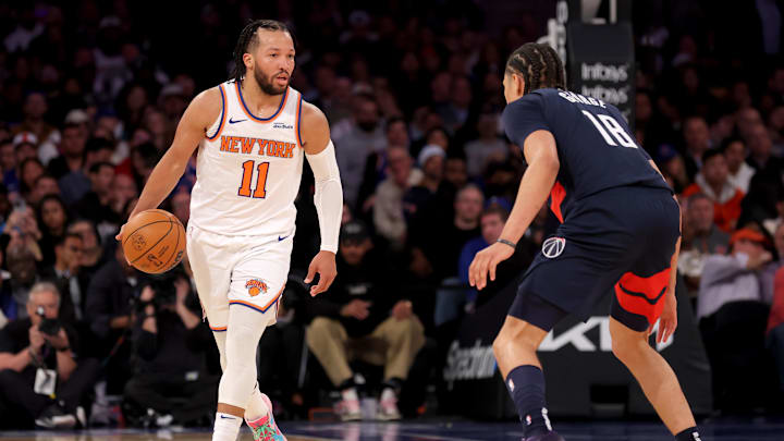 Nov 18, 2024; New York, New York, USA; New York Knicks guard Jalen Brunson (11) brings the ball up court against Washington Wizards forward Kyshawn George (18) during the third quarter at Madison Square Garden. Mandatory Credit: Brad Penner-Imagn Images