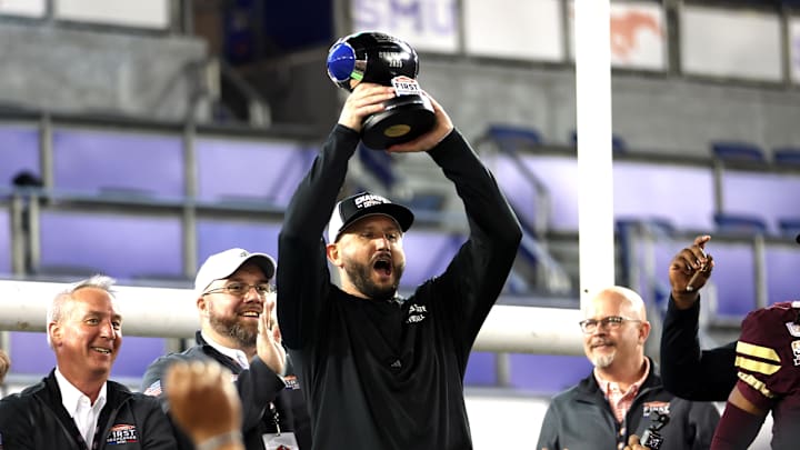 Jan 3, 2025; Dallas, TX, USA; Texas State Bobcats head coach GJ Kinne celebrates with the trophy after the game against the North Texas Mean Green at Gerald J. Ford Stadium. Mandatory Credit: Tim Heitman-Imagn Images