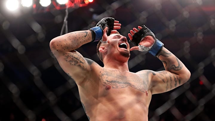 Nov 11, 2023; New York, NY, USA; Tom Aspinall (blue gloves) reacts to beating Sergei Pavlovich (red gloves) during UFC 295 at Madison Square Garden. Mandatory Credit: Wendell Cruz-Imagn Images