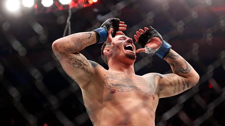 Nov 11, 2023; New York, NY, USA; Tom Aspinall (blue gloves) reacts to beating Sergei Pavlovich (red gloves) during UFC 295 at Madison Square Garden. Mandatory Credit: Wendell Cruz-Imagn Images