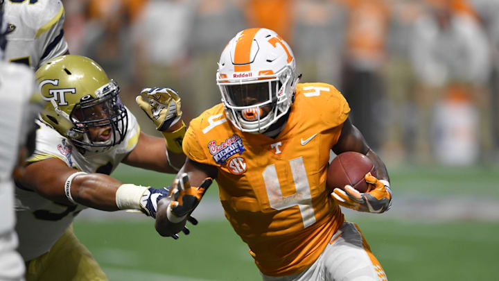 Tennessee's John Kelly runs the ball during the Volunteers' 2017 meeting with Georgia Tech.