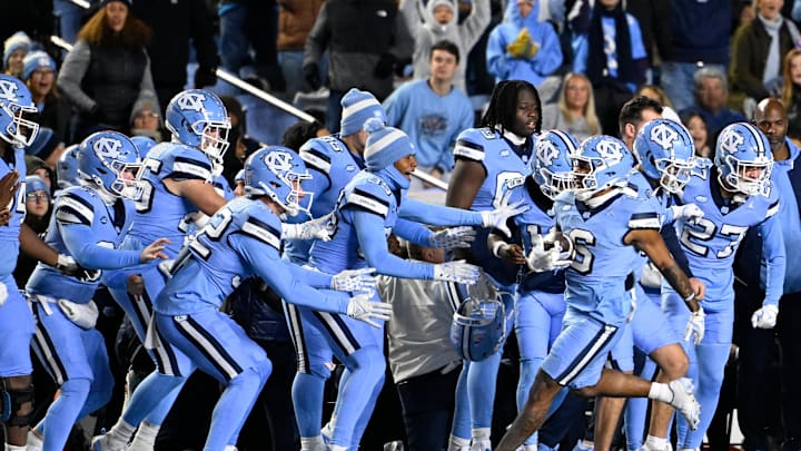 Nov 30, 2024; Chapel Hill, North Carolina, USA; North Carolina Tar Heels wide receiver Nate McCollum (6) with the ball in the fourth quarter at Kenan Memorial Stadium. 