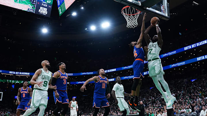 May 5, 2025; Boston, Massachusetts, USA; Boston Celtics guard Jaylen Brown (7) works the ball against New York Knicks forward Mikal Bridges (25) in the third quarter during game one of the second round for the 2025 NBA Playoffs at TD Garden. Mandatory Credit: David Butler II-Imagn Images