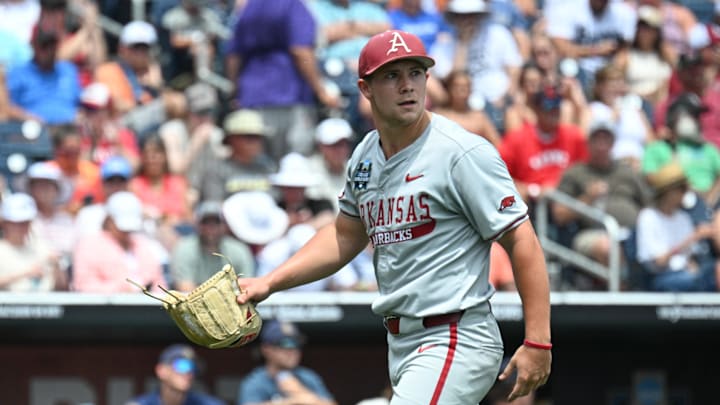 Arkansas Razorbacks starting pitcher Gage Wood (14) looks at the scoreboard.