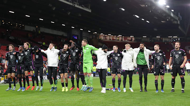 Bayern Munich players celebrating with fans after defeating Manchester United at Old Trafford on matchday six of the Champions League.