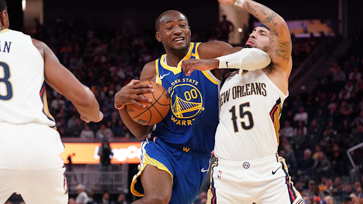 Oct 30, 2024; San Francisco, California, USA; Golden State Warriors forward Jonathan Kuminga (00) dribbles against New Orleans Pelicans guard Jose Alvarado (15) during the fourth quarter at Chase Center. Mandatory Credit: David Gonzales-Imagn Images