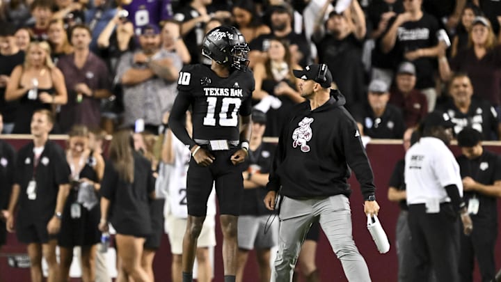 Oct 26, 2024; College Station, Texas, USA; Texas A&M Aggies quarterback Marcel Reed (10) celebrates after scoring a touchdown in the third quarter against the LSU Tigers at Kyle Field. Mandatory Credit: Maria Lysaker-Imagn Images. 