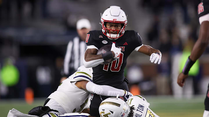 North Carolina State Wolfpack wide receiver Kevin Concepcion (10) runs the ball against the Georgia Tech Yellow Jackets in the first quarter at Bobby Dodd Stadium at Hyundai Field. North Carolina State Wolfpack wide receiver Kevin Concepcion (10) runs the ball against the Georgia Tech Yellow Jackets in the first quarter at Bobby Dodd Stadium at Hyundai Field.