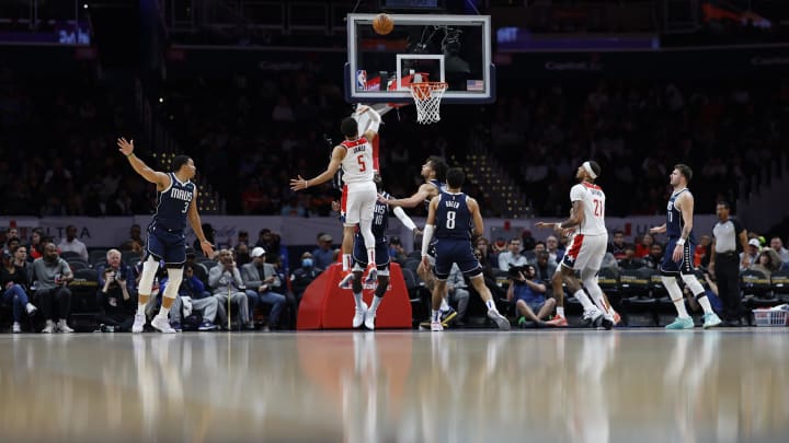 Nov 15, 2023; Washington, District of Columbia, USA; Washington Wizards guard Tyus Jones (5) shoots the ball over Dallas Mavericks forward Tim Hardaway Jr. (10) in the first quarter at Capital One Arena. Mandatory Credit: Geoff Burke-USA TODAY Sports
