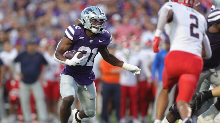 Kansas State Wildcats running back DJ Giddens (31) runs the ball during the first quarter of the game against Arizona at Bill Snyder Family Stadium Friday, September 13, 2024. Kansas State Wildcats running back DJ Giddens (31) runs the ball during the first quarter of the game against Arizona at Bill Snyder Family Stadium Friday, September 13, 2024.