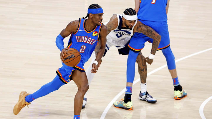 May 28, 2025; Oklahoma City, Oklahoma, USA; Oklahoma City Thunder guard Shai Gilgeous-Alexander (2) shoots the ball against Minnesota Timberwolves guard Nickeil Alexander-Walker (9) during the first quarter in game five of the western conference finals for the 2025 NBA Playoffs at Paycom Center. Mandatory Credit: Alonzo Adams-Imagn Images