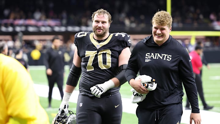 Trevor Penning (70) is headed to an AFC contender.