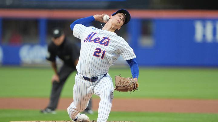 New York Mets pitcher Jonah Tong (21) delivers a pitch against the Cincinnati Reds during the third inning at Citi Field. Mandatory Credit: Gregory Fisher-Imagn Images