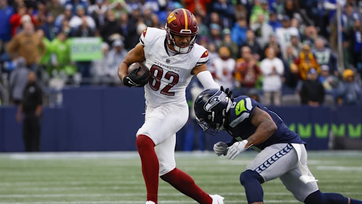 Nov 12, 2023; Seattle, Washington, USA; Washington Commanders tight end Logan Thomas (82) runs for yards after the catch against Seattle Seahawks safety Quandre Diggs (6) during the second quarter at Lumen Field. Mandatory Credit: Joe Nicholson-USA TODAY Sports