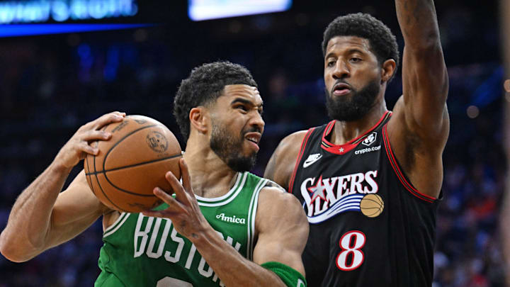 Apr 24, 2026; Philadelphia, Pennsylvania, USA; Boston Celtics forward Jayson Tatum (0) drives to the basket  against Philadelphia 76ers forward Paul George (8) during the first half at Xfinity Mobile Arena. Mandatory Credit: Eric Hartline-Imagn Images