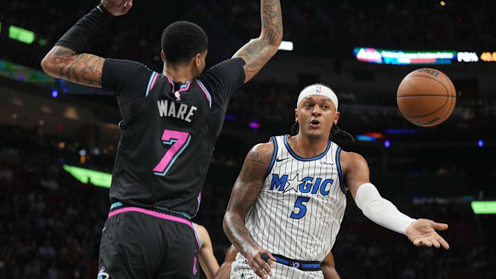 Mar 14, 2026; Miami, Florida, USA; Orlando Magic forward Paolo Banchero (5) passes the ball as he drives to the basket as Miami Heat center Kel'el Ware (7) defends during the first half at Kaseya Center. Mandatory Credit: Jim Rassol-Imagn Images Mar 14, 2026; Miami, Florida, USA; Orlando Magic forward Paolo Banchero (5) passes the ball as he drives to the basket as Miami Heat center Kel'el Ware (7) defends during the first half at Kaseya Center. Mandatory Credit: Jim Rassol-Imagn Images