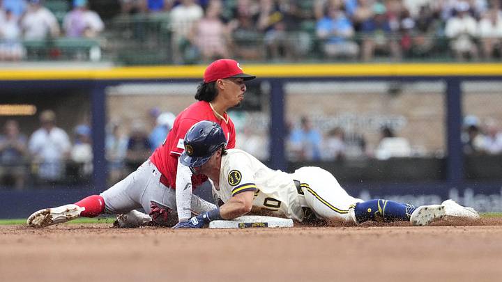 Jun 29, 2026; Milwaukee, Wisconsin, USA; Milwaukee Brewers right fielder Sal Frelick (10) slides safely into second base against Cincinnati Reds second baseman Edwin Arroyo (2) at American Family Field. Mandatory Credit: Michael McLoone-Imagn Images