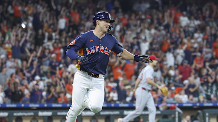 Houston Astros pinch hitter Shay Whitcomb (10) runs to first base on an RBI single during the ninth inning against the Los Angeles Angels at Minute Maid Park in 2024.