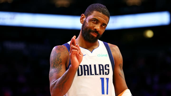 Dallas Mavericks guard Kyrie Irving reacts after a play during the first quarter against the Phoenix Suns at Footprint Center on December 27, 2024. 