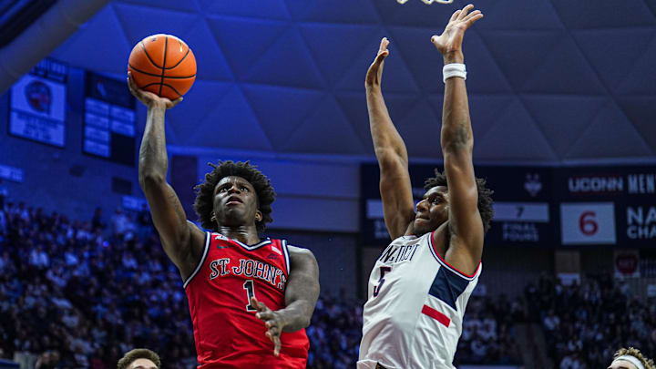 Feb 7, 2025; Storrs, Connecticut, USA; St. John's basketball guard Kadary Richmond (1) shoots the ball against UConn Huskies center Tarris Reed Jr. (5) in the second half at Harry A. Gampel Pavilion.