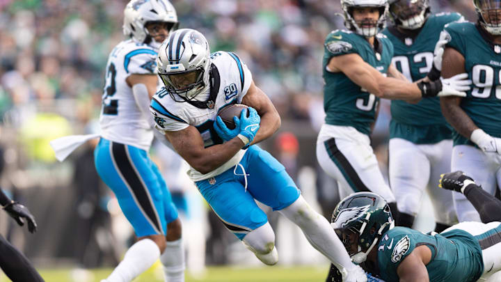 Dec 8, 2024; Philadelphia, Pennsylvania, USA;  Philadelphia Eagles linebacker Nakobe Dean (17) tackles Carolina Panthers running back Chuba Hubbard (30) at Lincoln Financial Field. Mandatory Credit: Bill Streicher-Imagn Images