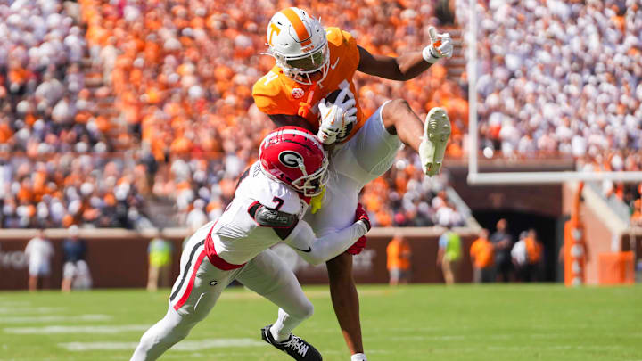 Georgia defensive back Daniel Harris (7) tackles Tennessee wide receiver Braylon Staley (14) as Staley catches the ball before a NCAA football game between Tennessee and Georgia at Neyland Stadium in Knoxville, Tennessee, on September 13, 2025.