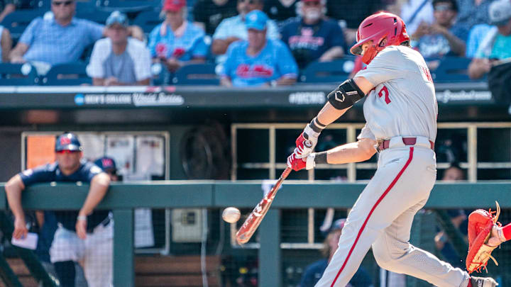 Jun 23, 2022; Omaha, NE, USA; Arkansas Razorbacks third baseman Cayden Wallace (7) lines out to right field to end the sixth inning against the Ole Miss Rebels at Charles Schwab Field. Jun 23, 2022; Omaha, NE, USA; Arkansas Razorbacks third baseman Cayden Wallace (7) lines out to right field to end the sixth inning against the Ole Miss Rebels at Charles Schwab Field.