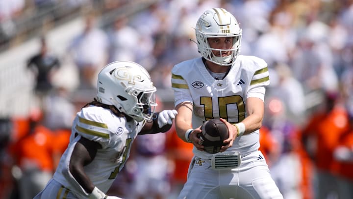 Sep 13, 2025; Atlanta, Georgia, USA; Georgia Tech Yellow Jackets quarterback Haynes King (10) hands the ball off to running back Jamal Haynes (1) against the Clemson Tigers in the second quarter at Bobby Dodd Stadium at Hyundai Field. Mandatory Credit: Brett Davis-Imagn Images