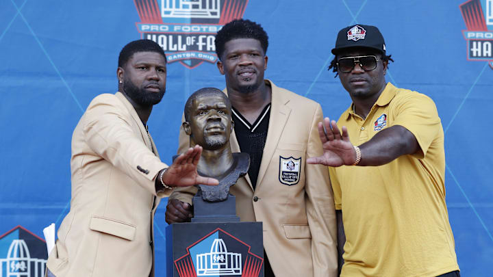 Aug 3, 2024; Canton, OH, USA;  University of Miami former players Devin Hester (left) and Andre Johnson (middle) and Edgerrin James (right) pose after Hester and Johnson joined James as inductees into the Pro Football Hall of Fame at the enshrinement ceremony at Tom Benson Hall of Fame Stadium. Mandatory Credit: Charles LeClaire-Imagn Images