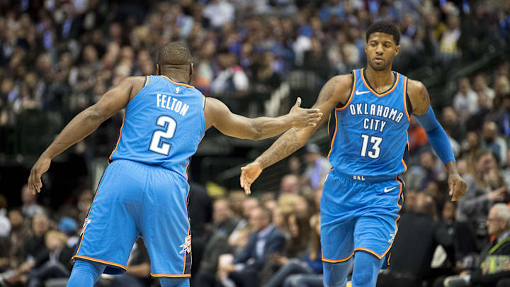 Nov 10, 2018; Dallas, TX, USA; Oklahoma City Thunder guard Raymond Felton (2) and forward Paul George (13) celebrate during the first half against the Dallas Mavericks at the American Airlines Center. Mandatory Credit: Jerome Miron-Imagn Images