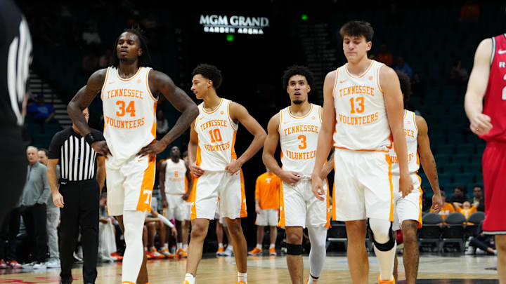 Nov 24, 2025; Las Vegas, NV, USA; Tennessee Volunteers forward Felix Okpara (34), forward Nate Ament (10), guard Bishop Boswell (3) and forward J.P. Estrella (13) come back onto the court after a time during the first half against the Rutgers Scarlet Knights in a 2025 Players Era Festival group play game at MGM Grand Garden Arena. Mandatory Credit: Stephen R. Sylvanie-Imagn Images