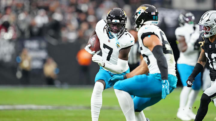 Dec 22, 2024; Paradise, Nevada, USA; Jacksonville Jaguars wide receiver Brian Thomas Jr. (7) gains yardage against the Las Vegas Raiders during the first quarter at Allegiant Stadium. Mandatory Credit: Stephen R. Sylvanie-Imagn Images