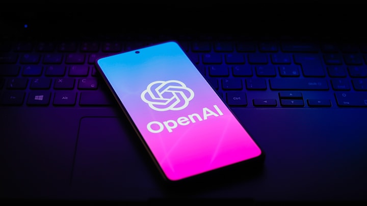 In this photo illustration, the OpenAI logo is displayed on...