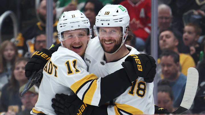 Mar 8, 2026; Pittsburgh, Pennsylvania, USA;  Boston Bruins center Casey Mittelstadt (11) congratulates center Pavel Zacha (18) on his second goal of the game against the Pittsburgh Penguins during the second period at PPG Paints Arena. Mandatory Credit: Charles LeClaire-Imagn Images