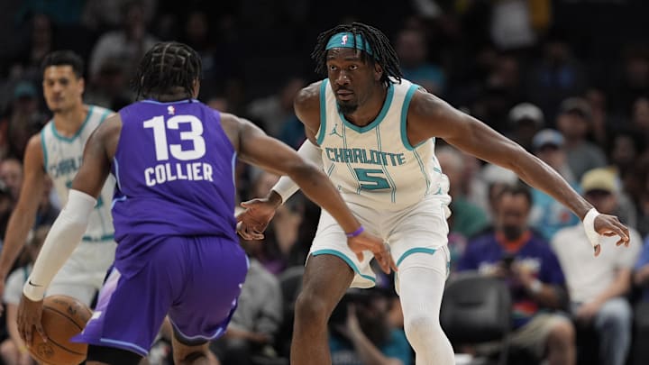 Mar 31, 2025; Charlotte, North Carolina, USA; Charlotte Hornets center Mark Williams (5) on defense against Utah Jazz guard Isaiah Collier (13) during the second  quarter at Spectrum Center. Mandatory Credit: Jim Dedmon-Imagn Images