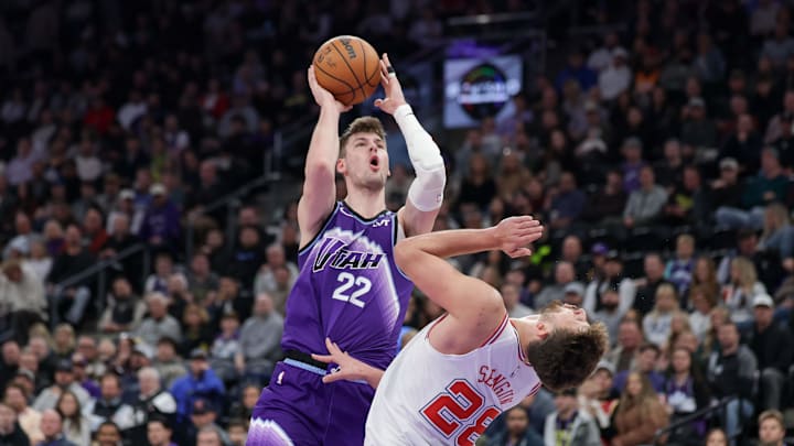 Dec 1, 2025; Salt Lake City, Utah, USA;  Utah Jazz forward Kyle Filipowski (22) commits a second offensive foul on Houston Rockets center Alperen Sengun (28) during the second quarter at Delta Center. Mandatory Credit: Chris Nicoll-Imagn Images