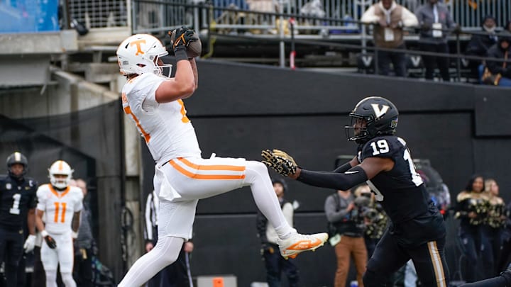 Tennessee tight end Miles Kitselman (87) catches a touchdown pass over Vanderbilt safety De'Rickey Wright (19) during the second quarter at FirstBank Stadium in Nashville, Tenn., Saturday, Nov. 30, 2024.