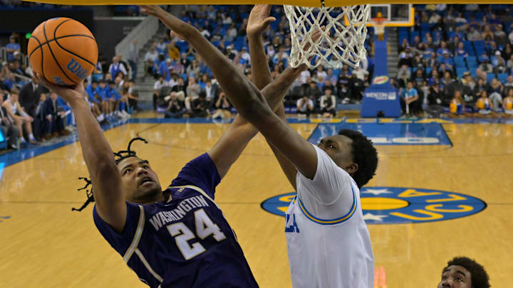 Feb 7, 2026; Los Angeles, California, USA; UCLA Bruins forward Xavier Booker (1) defends a shot by Washington Huskies center Lathan Sommerville (24) in the second half at Pauley Pavilion presented by Wescom Financial. Mandatory Credit: Jayne Kamin-Oncea-Imagn Images