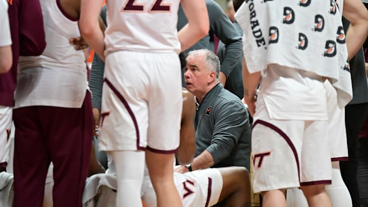 Mar 1, 2025; Virginia Tech head coach Mike Young talks to his team during a timeout.