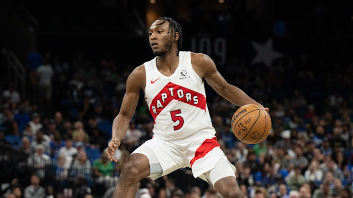 Mar 17, 2024; Orlando, Florida, USA; Toronto Raptors guard Immanuel Quickley (5) dribbles the ball against the Orlando Magic in the fourth quarter  at KIA Center. Mandatory Credit: Jeremy Reper-Imagn Images