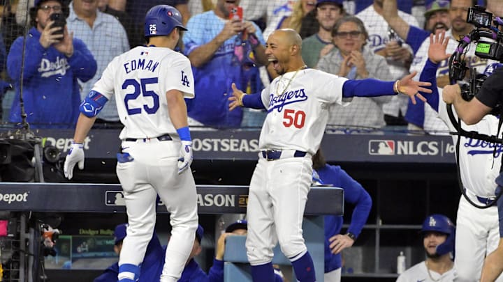 Oct 20, 2024; Los Angeles, California, USA; Los Angeles Dodgers shortstop Tommy Edman (25) celebrates with outfielder Mookie Betts (50) after hitting a two run home run in the third inning against the New York Mets during game six of the NLCS for the 2024 MLB playoffs at Dodger Stadium. Mandatory Credit: Jayne Kamin-Oncea-Imagn Images Oct 20, 2024; Los Angeles, California, USA; Los Angeles Dodgers shortstop Tommy Edman (25) celebrates with outfielder Mookie Betts (50) after hitting a two run home run in the third inning against the New York Mets during game six of the NLCS for the 2024 MLB playoffs at Dodger Stadium. Mandatory Credit: Jayne Kamin-Oncea-Imagn Images