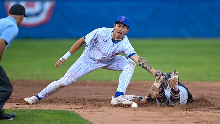 CHATHAM. 07/23/24 Aiva Arquette of Chatham reaches for the throw as Isaiah Barrett of Falmouth dives into second. Cape League baseball